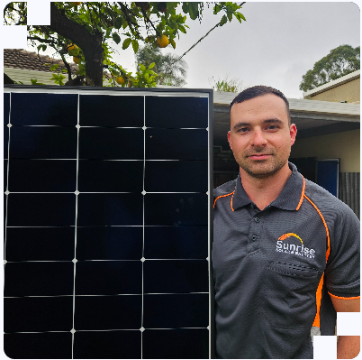 Zachary Zoumis on a solar installation project